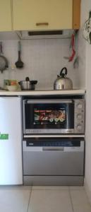 Kuchyň nebo kuchyňský kout v ubytování Loutraki-SPA-Apartment