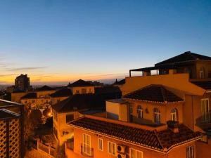 a group of buildings in a city at sunset at Apartamento centro de Granada 2 in Granada