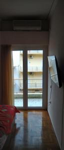 Postel nebo postele na pokoji v ubytování Loutraki-SPA-Apartment
