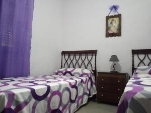 A bed or beds in a room at Casa de Pascual