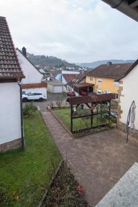 a view of a yard with a fence and a house at Ferienhaus Nepomuk in Lauterecken