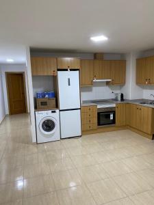 Kuchyň nebo kuchyňský kout v ubytování Apartamentos Wei