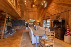 a dining room with a table and chairs in a cabin at Beech Haven in Beech Mountain