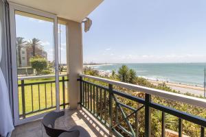 a balcony with a view of the ocean at Luxury Studio with a View in Summerstrand