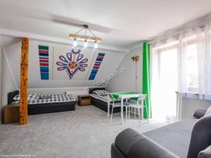 Postel nebo postele na pokoji v ubytování Domek na Wzgórzu