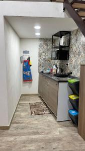 A kitchen or kitchenette at TAPIA'S ROOMS one
