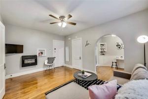 a living room with a couch and a ceiling fan at Lower-Greenville Landing Close to Everything in Dallas