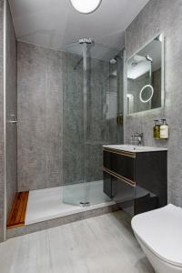 a bathroom with a shower and a sink at The Melbreak Hotel in Great Clifton