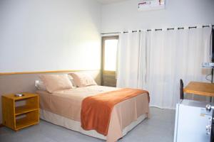 Een bed of bedden in een kamer bij Pousada Rural Estação Verde