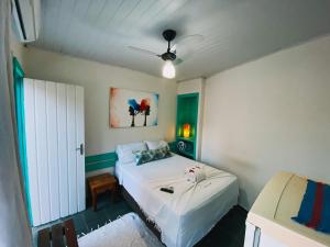 En eller flere senge i et værelse på Anacã Pousada