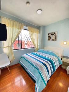 מיטה או מיטות בחדר ב-Hostal Brilliant