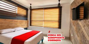 Voodi või voodid majutusasutuse Hotel Murali - Cerca del Aeropuerto de Guayaquil toas
