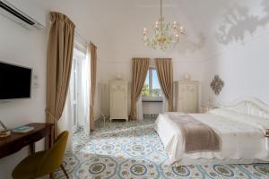 Postel nebo postele na pokoji v ubytování Penthouse Donna Carmela + 61 fotografií