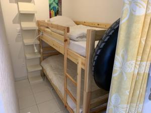 a couple of bunk beds in a room at Appartement proche plage avec parking et balcon - FR-1-482-102 in Fort-Mahon-Plage