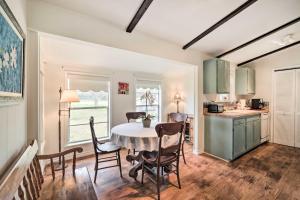 a kitchen and dining room with a table and chairs at Carmine Cottage with Porch on Beautiful 60-Acre Farm in Carmine