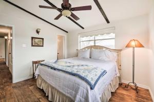 a bedroom with a bed and a ceiling fan at Carmine Cottage with Porch on Beautiful 60-Acre Farm in Carmine