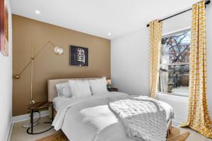 a bedroom with a bed and a window at The Sinatra in Bentonville