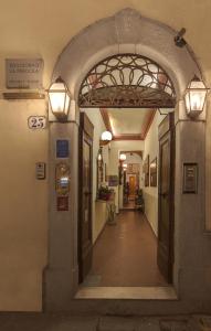 an entrance to a building with an archway and lights at Soggiorno La Pergola in Florence