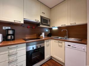 A kitchen or kitchenette at Stay Unique Apartments Bruc