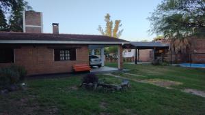 a house with a car parked in the yard at LA CASA in Villa Anizacate