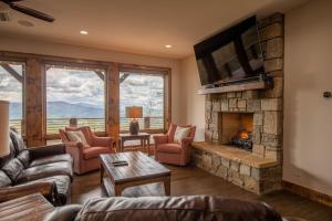 a living room with a couch and a fireplace at Clouds Rest at Eagles Nest in Beech Mountain