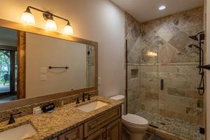 a bathroom with a toilet and a sink and a shower at Clouds Rest at Eagles Nest in Beech Mountain