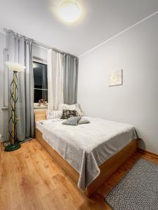 Postel nebo postele na pokoji v ubytování Mieszkanie Rumia Trójmiasto Kaszuby