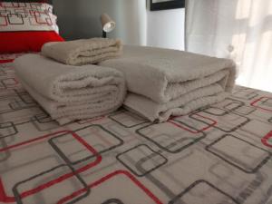 Łóżko lub łóżka w pokoju w obiekcie Appartamento Copernico