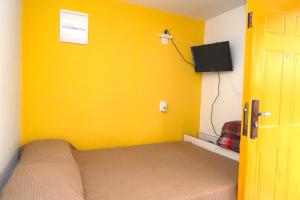 TV a/nebo společenská místnost v ubytování Cabaña en Punta del Diablo 001