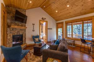 a living room with a couch and a fireplace at Banner Sky in Banner Elk