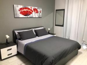 Łóżko lub łóżka w pokoju w obiekcie Appartamento Copernico