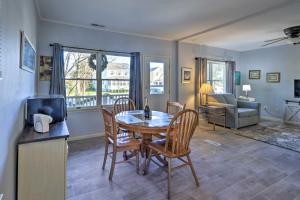 a living room with a table and chairs and a couch at Serene West Cape May Getaway Walk to Beach! in Cape May