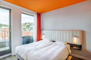 Krevet ili kreveti u jedinici u okviru objekta Park Inn by Radisson Stuttgart