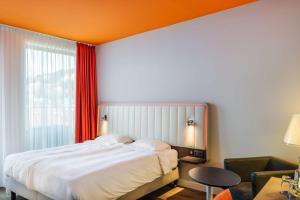 Krevet ili kreveti u jedinici u okviru objekta Park Inn by Radisson Stuttgart