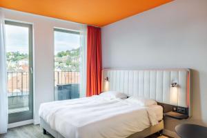 Krevet ili kreveti u jedinici u okviru objekta Park Inn by Radisson Stuttgart