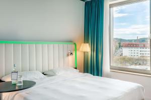 Krevet ili kreveti u jedinici u okviru objekta Park Inn by Radisson Stuttgart