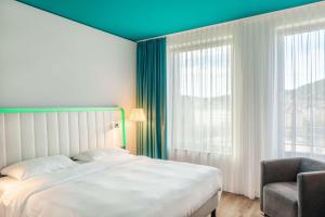 Krevet ili kreveti u jedinici u okviru objekta Park Inn by Radisson Stuttgart