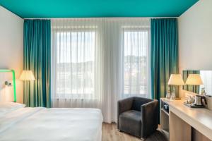 Krevet ili kreveti u jedinici u okviru objekta Park Inn by Radisson Stuttgart