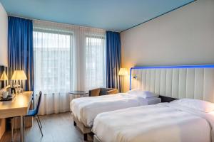 Postel nebo postele na pokoji v ubytování Park Inn by Radisson Stuttgart + 37 fotografií