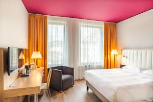 Krevet ili kreveti u jedinici u okviru objekta Park Inn by Radisson Stuttgart