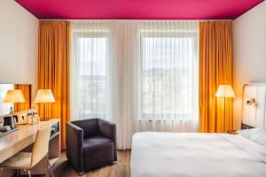 Krevet ili kreveti u jedinici u okviru objekta Park Inn by Radisson Stuttgart