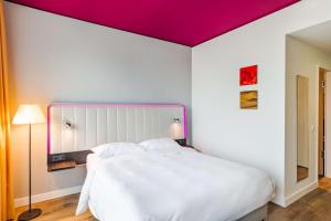Krevet ili kreveti u jedinici u okviru objekta Park Inn by Radisson Stuttgart