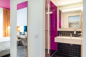 Krevet ili kreveti u jedinici u okviru objekta Park Inn by Radisson Stuttgart
