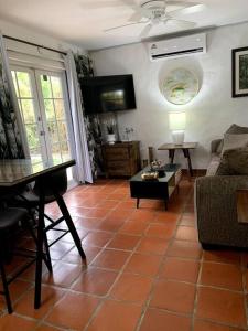 a living room with a couch and a table at Reefside Villa in Crown Point