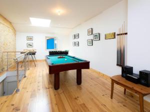 a room with a pool table in the middle of it at Gîte Laneuveville-devant-Bayon, 5 pièces, 9 personnes - FR-1-584-15 