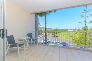 a balcony with a table and chairs and a view at Resort Rooms at Bells Boulevard in Kingscliff