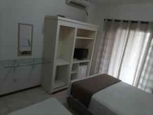 Voodi või voodid majutusasutuse Pousada Cama & Café toas