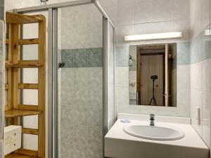 a bathroom with a sink and a mirror at Cocon 2 pièces + studio au centre de Combloux avec parking - FR-1-560-74 in Combloux +14 photos