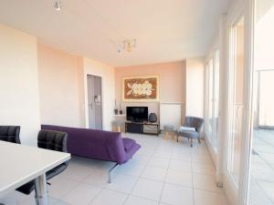 a living room with a purple couch and chairs at Appartement Évian-les-Bains, 2 pièces, 4 personnes - FR-1-498-69 in Évian-les-Bains