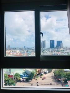 a view of a city from a window at Căn hộ hướng núi mới ở thành phố Quy Nhơn in Quy Nhon